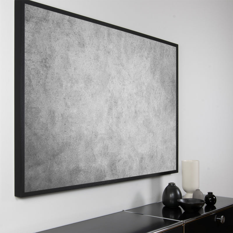 Akustikbild "Shade" der Serie Magnitudo mit dunklem Vollholzrahmen und grauem, abstraktem Fotomotiv in Querformat und seitlicher Ansicht