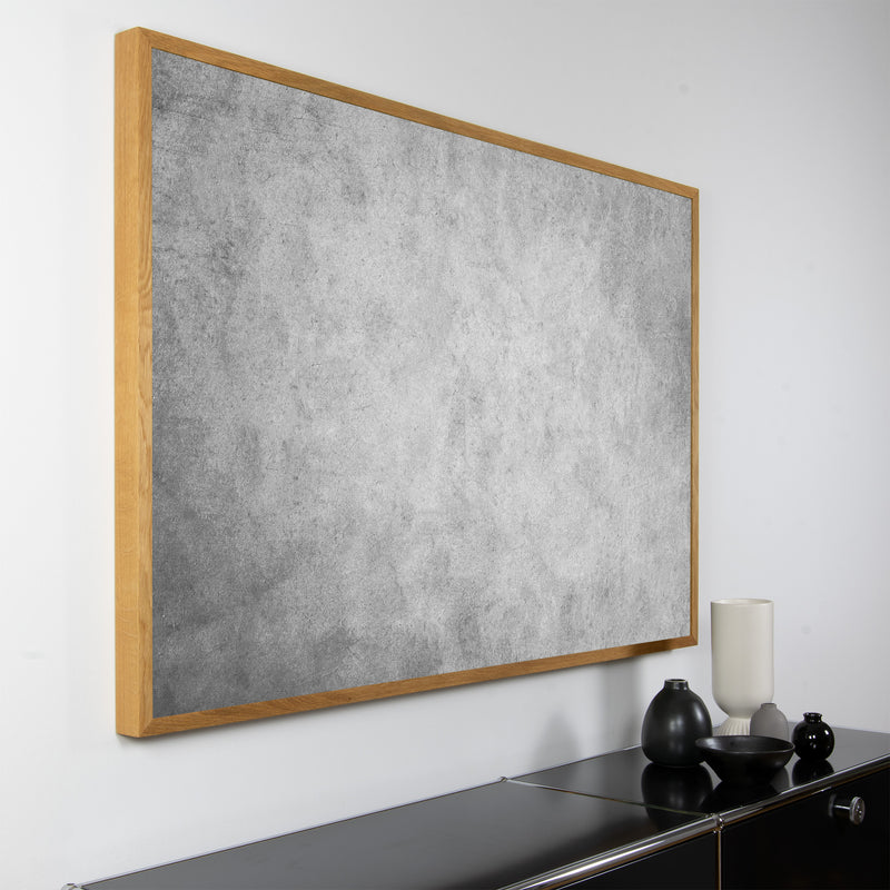 Akustikbild "Shade" der Serie Magnitudo mit hellem Vollholzrahmen und grauem, abstraktem Fotomotiv in Querformat und seitlicher Ansicht